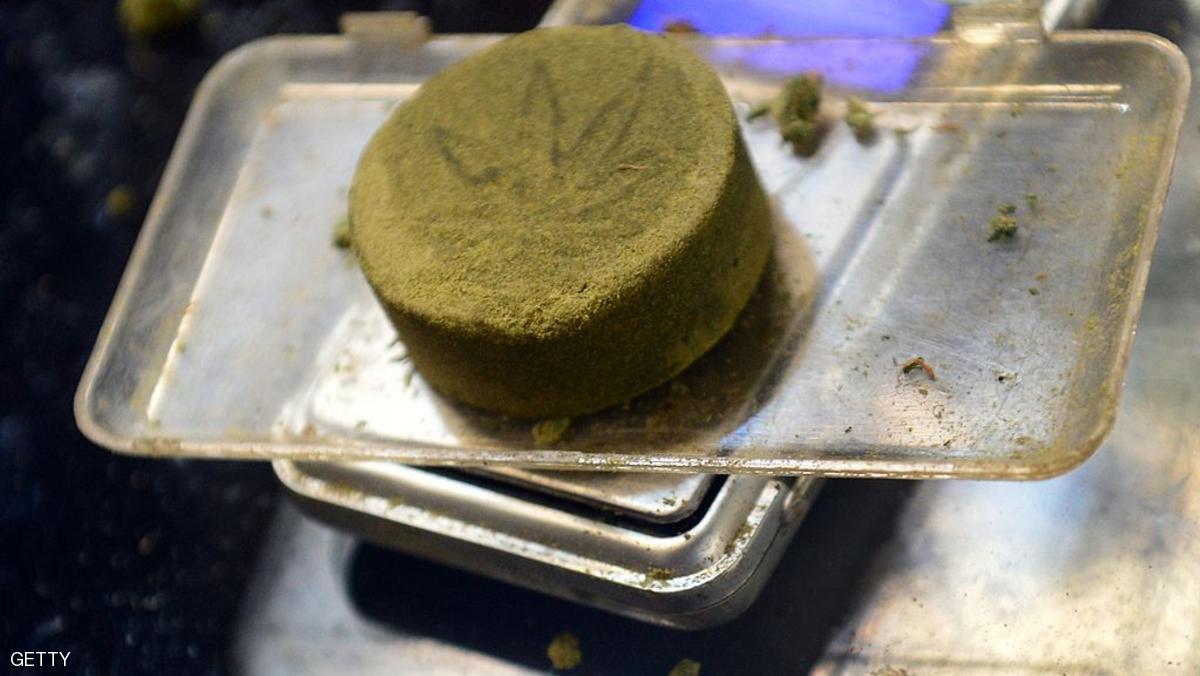 Kief, pressed into a cake of hashish, is placed on a sclale by a vendor weighing it for card-carrying medical marijuana patients attending Los Angeles' first-ever cannabis farmer's market at the West Coast Collective medical marijuana dispensary, on the fourth of July, or Independence Day, in Los Angeles, California on July 4, 2014 where organizer's of the 3-day event plan to showcase high quality cannabis from growers and vendors throughout the state. AFP PHOTO/Frederic J. BROWN (Photo credit should read FREDERIC J. BROWN/AFP/Getty Images)