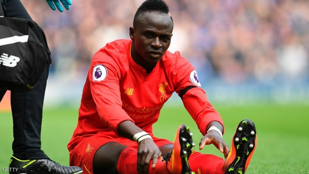 Liverpool's Senegalese midfielder Sadio Mane reacts after picking up an injury during the English Premier League football match between Liverpool and Everton at Anfield in Liverpool, north west England on April 1, 2017. / AFP PHOTO / Paul ELLIS / RESTRICTED TO EDITORIAL USE. No use with unauthorized audio, video, data, fixture lists, club/league logos or 'live' services. Online in-match use limited to 75 images, no video emulation. No use in betting, games or single club/league/player publications. / (Photo credit should read PAUL ELLIS/AFP/Getty Images)