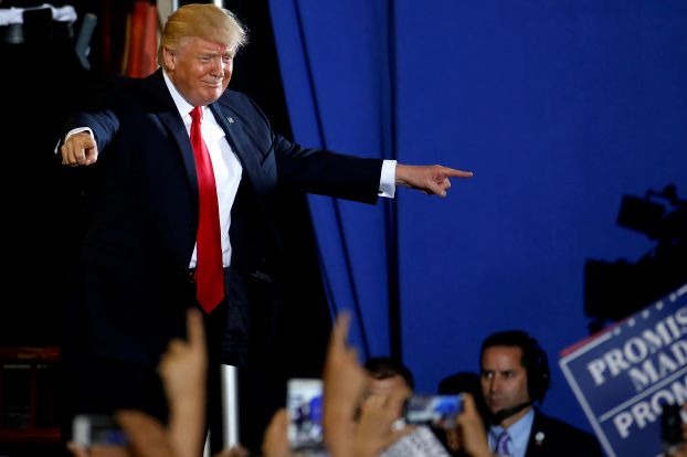 U.S. President Donald Trump appears on stage at a rally in Harrisburg, Pennsylvania, U.S. April 29, 2017. REUTERS/Carlo Allegri TPX IMAGES OF THE DAY