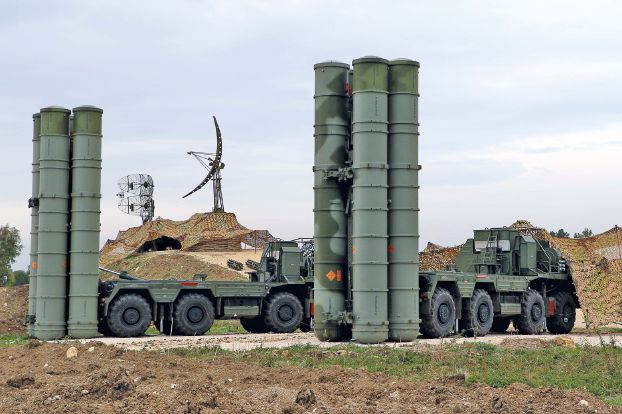 A picture shows two Russian S-400 Triumf S-400 Triumf missile system at the Russian Hmeimin military base in Latakia province, in the northwest of Syria, on December 16, 2015. Russia began its air war in Syria on September 30, conducting air strikes against a range of anti-regime armed groups including US-backed rebels and jihadist groups. Moscow has said it is fighting and other "terrorist groups," but its campaign has come under fire by Western officials who accuse the Kremlin of seeking to prop up Syrian President Bashar al-Assad. / AFP / Paul GYPTEAU