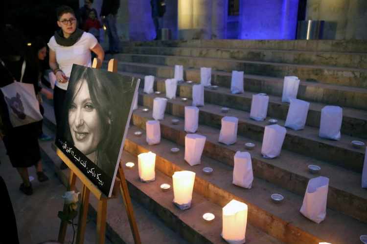 A photo of the British embassy worker, Rebecca Dykes, is seen during a candlelight sit-in organised by activists in Beirut, Lebanon December 23, 2017. REUTERS/Isam Abdallah - RC197B301360