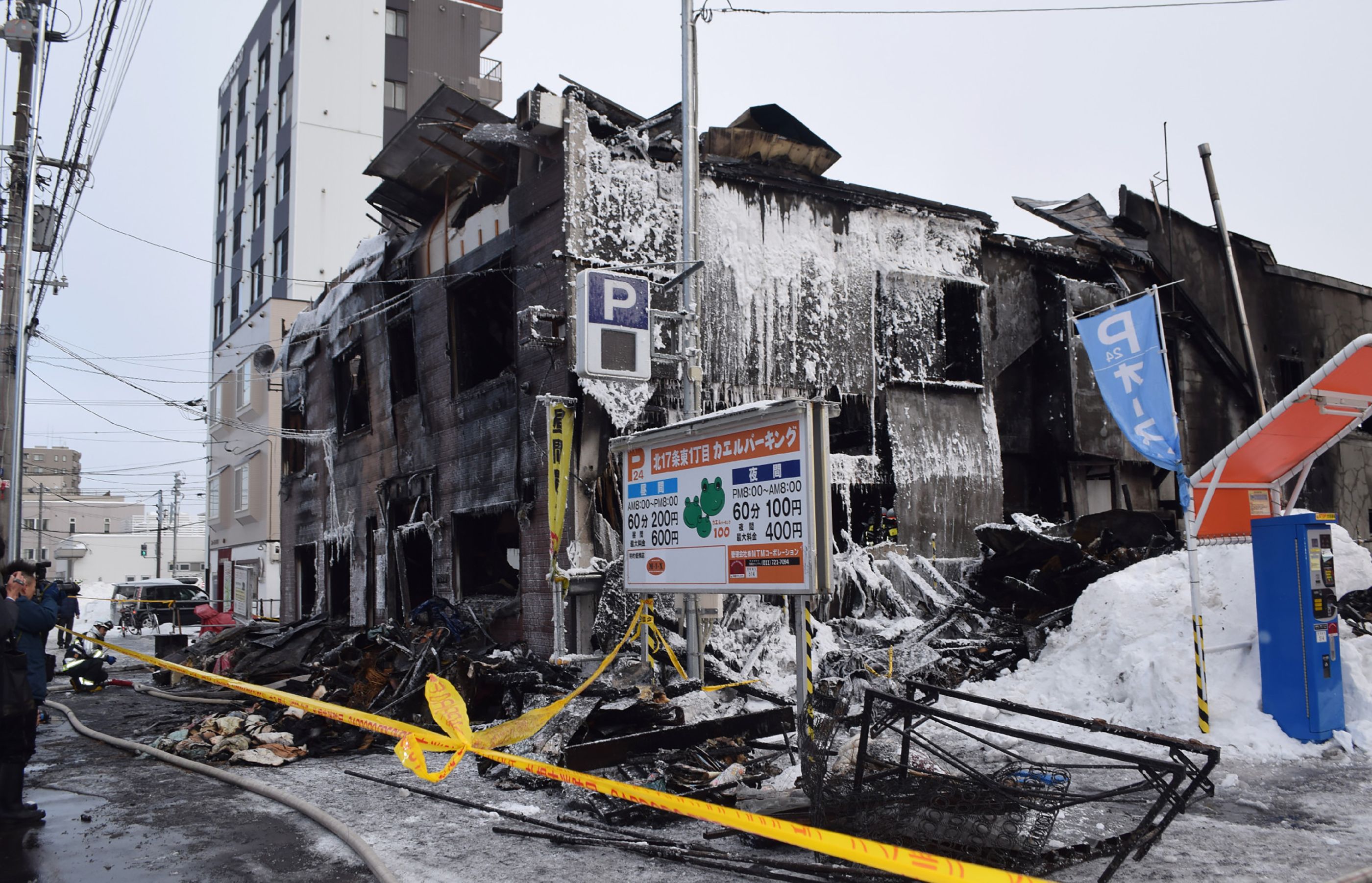 A general view shows the ruins of a fire at a residence for elderly people in Sapporo, northern Japan, on February 1, 2018.
Eleven people died after a fire broke out at a residence for elderly people with financial difficulties in northern Japan, police said on February 1. / AFP PHOTO / JIJI PRESS / - / Japan OUT