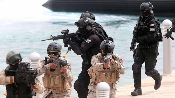 AQABA, JORDAN- JUNE 5: Multi national armies perform an anti terrorism and rescue exercise in Aqaba port, south Jordan, June 5, 2014. Around 12,500 participants from more than 20 countries take part in Eager Lion exercise. (Photo by Jordan Pix/ Getty Images)