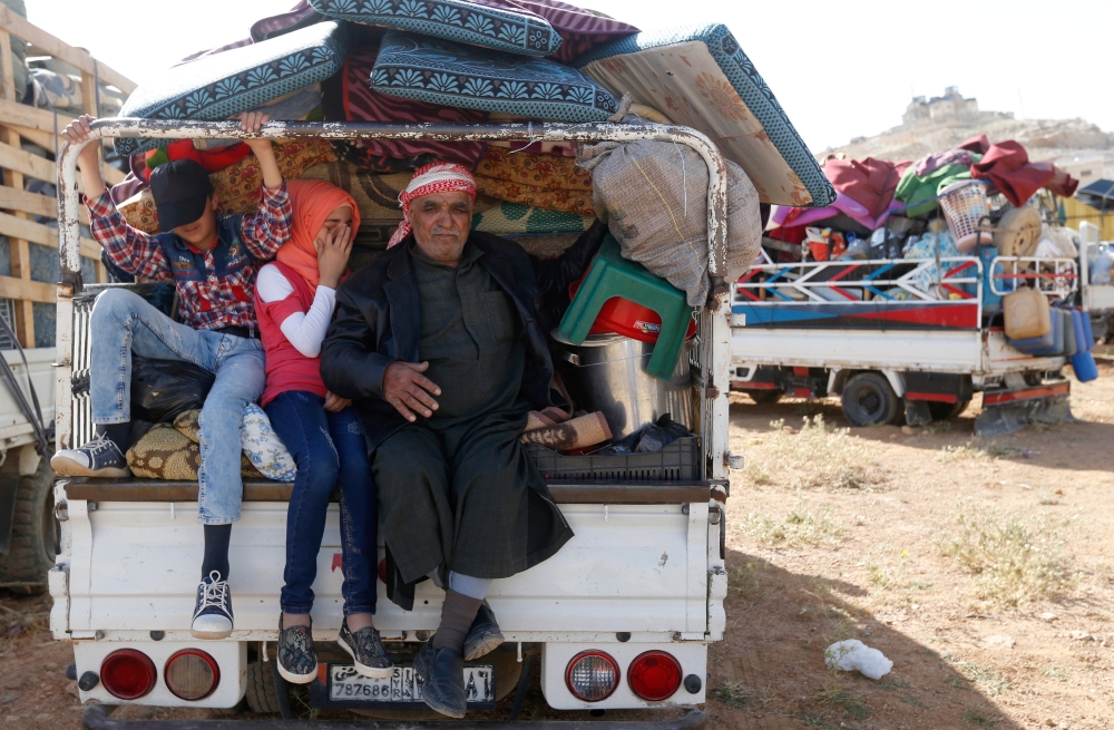 Syrian refugees prepare to return to Syria from the Lebanese border town of Arsal, Lebanon June 28, 2018. REUTERS/Mohamed Azakir