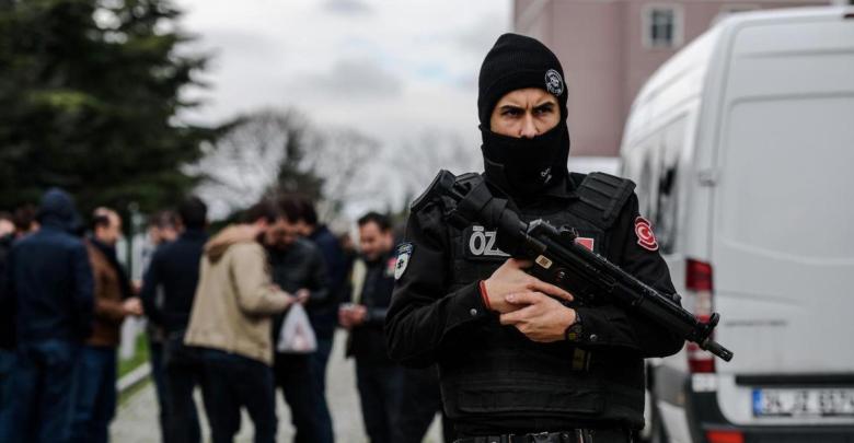 A Turkish anti-riot police officer stands guard in front of the headquarters of Turkish daily newspaper Zaman in Istanbul on March 5, 2016, after Turkish authorities seized the headquarters in a midnight raid. Turkish authorities were on March 5 in control of the newspaper staunchly opposed to President Recep Tayyip Erdogan after using tear gas and water cannon to seize its headquarters in a dramatic raid that raised fresh alarm over declining media freedoms. Police fired the tear gas and water cannon just before midnight at a hundreds-strong crowd that had formed outside the headquarters of the Zaman daily in Istanbul following a court order issued earlier in the day. / AFP / OZAN KOSE (Photo credit should read OZAN KOSE/AFP/Getty Images)