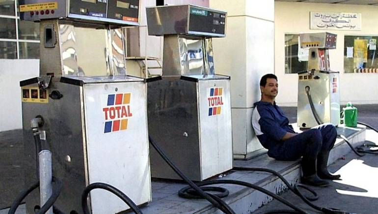 BEIRUT, LEBANON: A worker sits idle at a gas station in Beirut 05 February 2002. Lebanon is threatened with severe fuel shortages due to difficulties in introducing a 10-percent value-added tax (VAT) which took effect 01 February, a leading fuel distributor told AFP. Since yesterday, some gas stations have closed their pumps and half of the 500 stations in the greater Beirut area risk not being able to offer unleaded fuel, the least expensive and most in demand. AFP PHOTO/Joseph BARRAK (Photo credit should read JOSEPH BARRAK/AFP/Getty Images)