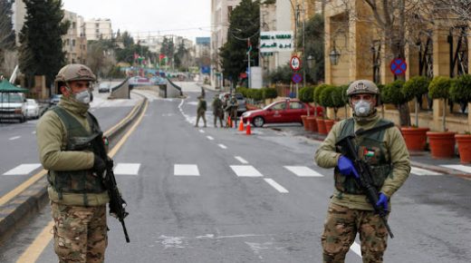 Jordanian army members stand guard at a check point after the start of a nationwide curfew, amid concerns over the coronavirus disease (COVID-19) spread, in Amman, Jordan March 21, 2020. REUTERS/Muhammad Hamed