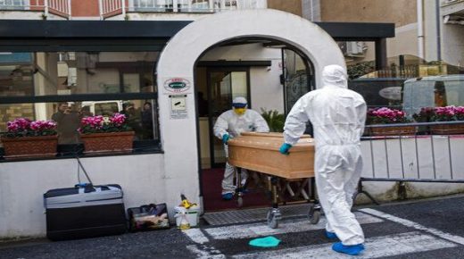 Medical staff wearing protective suits carry the coffin containing the body of Assunta Pastore, 87, after she passed away in her room at the Garden hotel in Laigueglia, northwest Italy, Liguria region, Sunday March 1, 2020. The woman, part of a group of elderly tourist from the Lombardia region, tested positive of the COVID-19. The hotel has been placed under quarantine as Italy continued to scramble Sunday to contain the spread of the corona virus. (AP Photo)