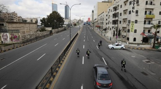 Jordanian police personnel guard at a checkpoint during the second day of a nationwide curfew, amid concerns over the spread of coronavirus disease (COVID-19), in Amman, Jordan March 22, 2020. REUTERS/Muhammad Hamed