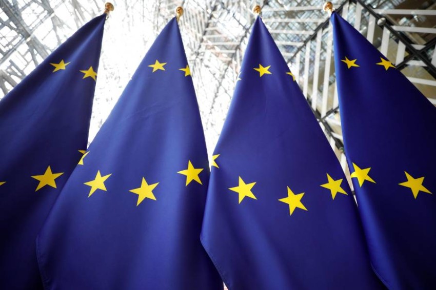 European flags are pictured as European Union leaders arrive for the third straight day of a summit in Brussels on July 2, 2019, for talks aimed at defusing fresh power struggles in a bid to fill the bloc's top jobs. (Photo by GEOFFROY VAN DER HASSELT / AFP);264 مليار دولار ائتمان مفتوح لدول الاتحاد الأوروبي