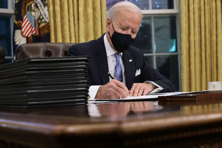 WASHINGTON, DC - JANUARY 20: U.S. President Joe Biden prepares to sign a series of executive orders at the Resolute Desk in the Oval Office just hours after his inauguration on January 20, 2021 in Washington, DC. Biden became the 46th president of the United States earlier today during the ceremony at the U.S. Capitol. Chip Somodevilla/Getty Images/AFP
== FOR NEWSPAPERS, INTERNET, TELCOS & TELEVISION USE ONLY ==